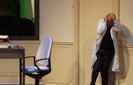 Anthony Pilavachi’s stage direction of Siegfried at Theater Lübeck (2009) shows Mime as a laboratory scientist whose hammering leads to an intense headache. Photo: Jörg Metzner Anthony Pilavachi's stage direction of Siegfried at Theater Lübeck (2009) shows Mime as a laboratory scientist whose hammering leads to an intense headache. Photo: Jörg Metzner